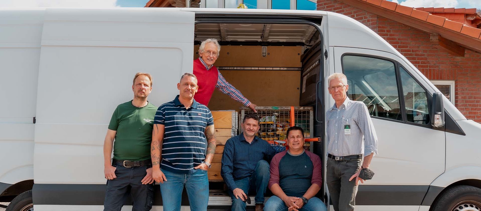 deister electronic employees in front of a white sprinter
