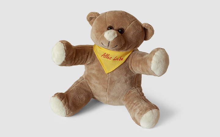 brauner Teddybär mit gelben Halstuch