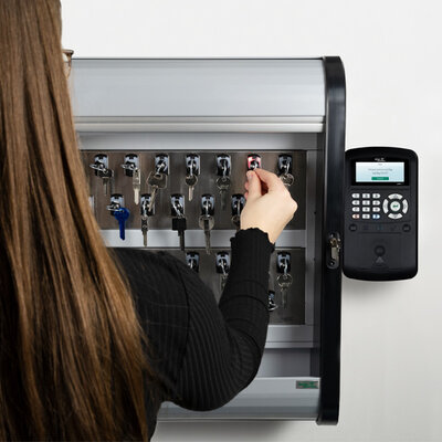 a person withdrawing a keytag from maxx 6u