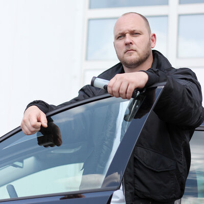 security personnel with wand in his hand