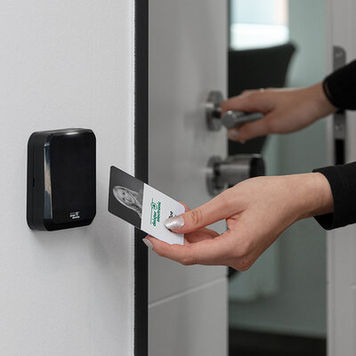 Access Control Reader RFID person scanning credential at Access Control Reader