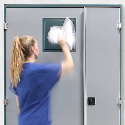 Nurse throws laundry into return cabinet