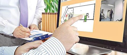 Hand zeigt auf Computerbildschirm