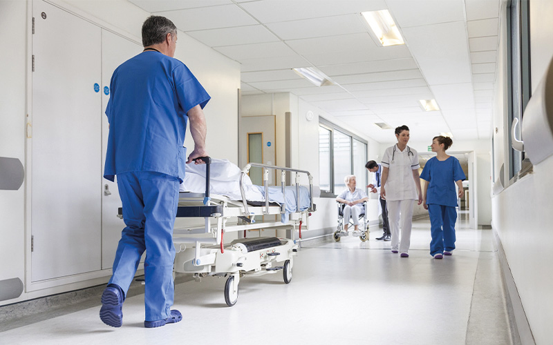 Hospital corridor with hospital staff